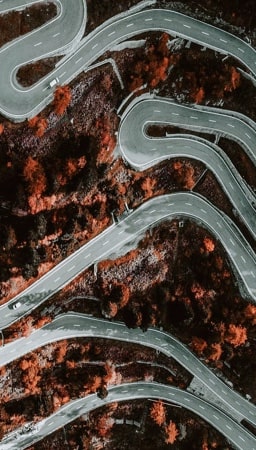 Image of a road stretching on a hill